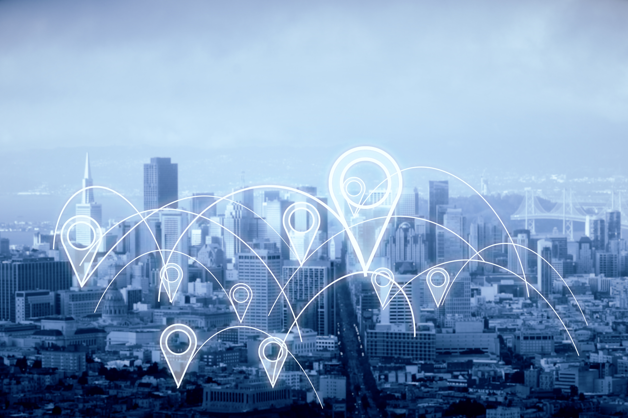 City with abstract connected by geolocation pins. Dull sky background.