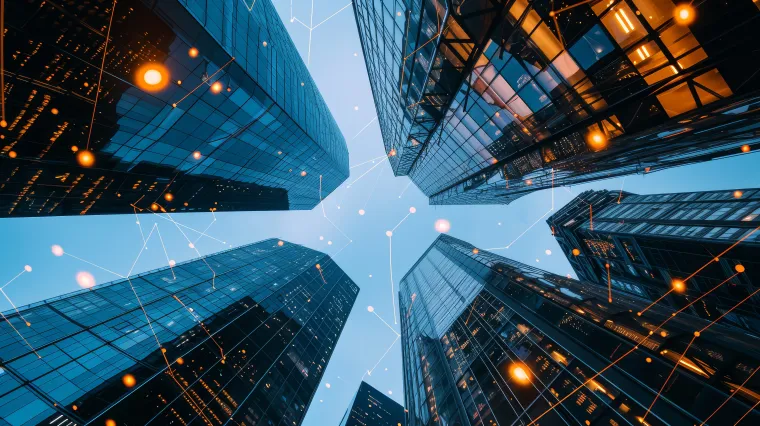 looking at tall skyscrapers from ground up with data points connecting them to illustrate message connectivity